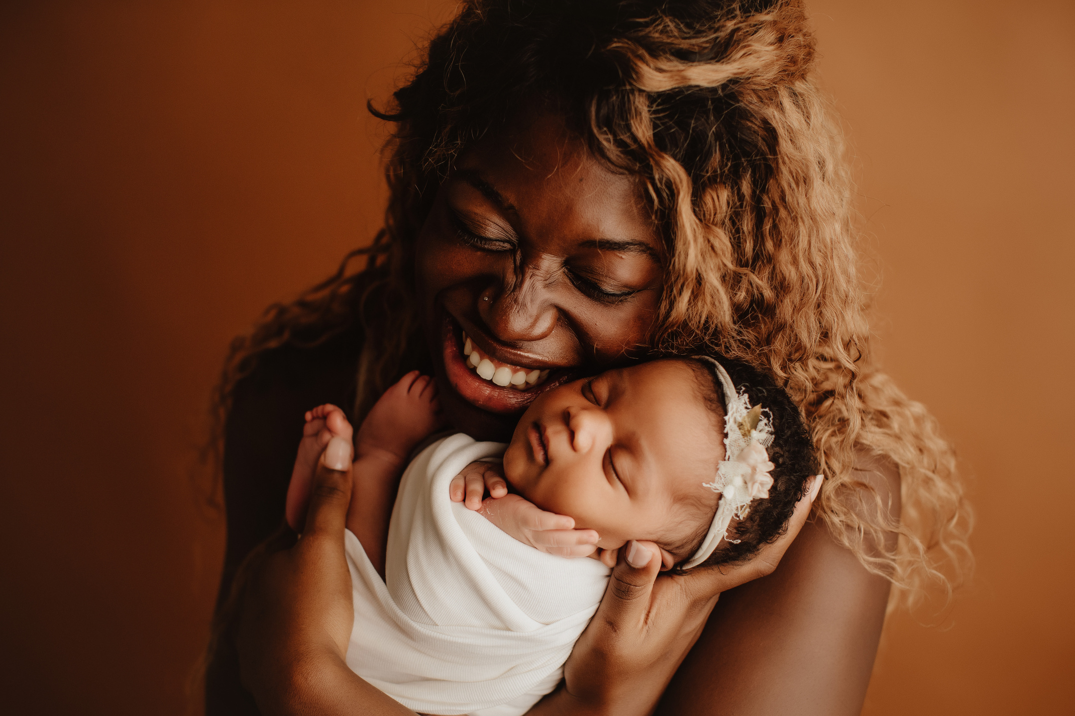 Mother and Newborn Child in a Studio Shoot 
